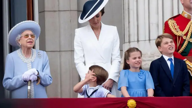 Louis stood next to the Queen, known affectionately as "Gan Gan" to the Cambridge children, and she leaned down to talk to her great-grandson, pointing out things of interest to the four-year-old.  	