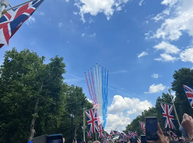The Queen smiled as the flypast roared over Buckingham Palace