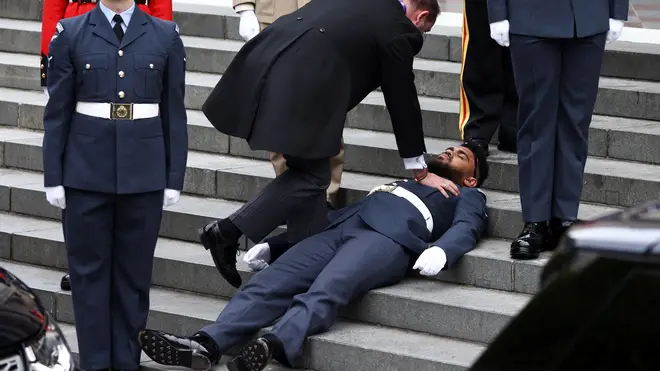 Guardsman faints before the National Service of Thanksgiving