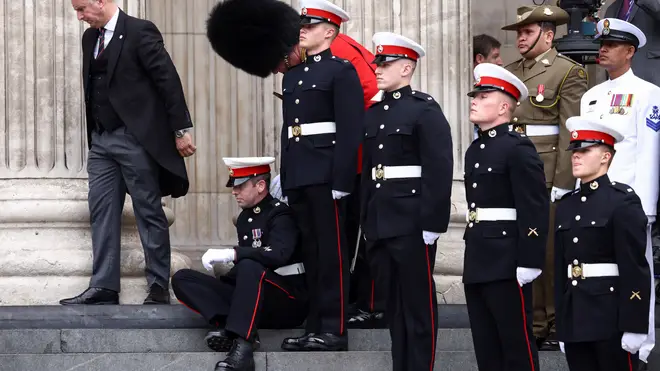 A second guard was seen struggling on the steps.
