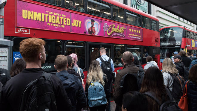 Commuters queueing for London buses this morning