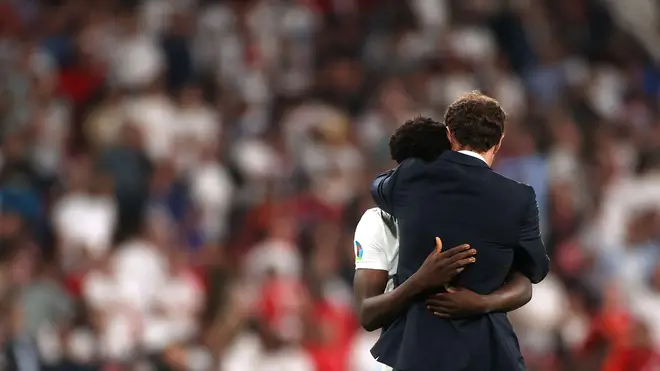 Southgate, who missed his own penalty in Euro 96, consoles Saka after the Euro 2020 Final