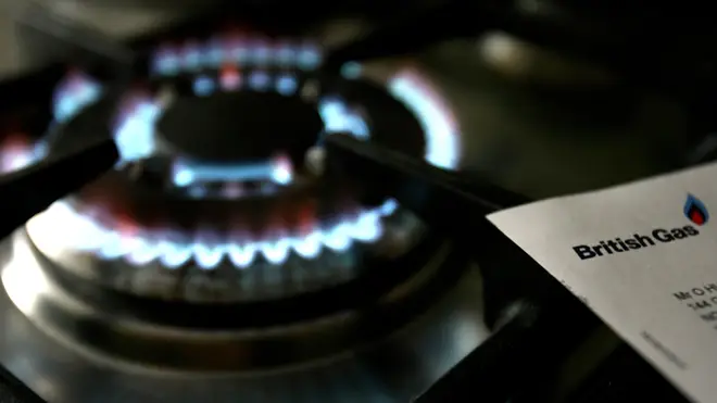 An energy bill next to a domestic gas ring
