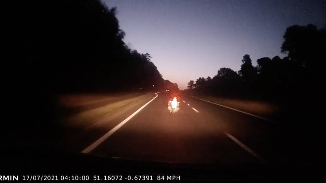 Footage released by Surrey Police with the victim's permission shows the driver speeding along Route A at over 80mph before slamming into the biker's back. 