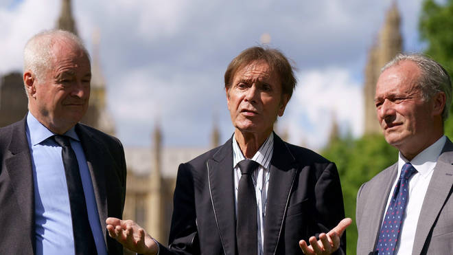 DJ Paul Gambaccini, singer Sir Cliff Richard and Daniel Janner QC speaking to the media outside the Palace of Westminster in London