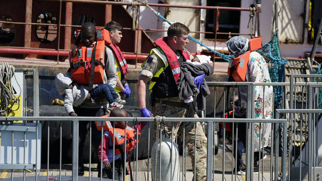Migrants including a heavily pregnant woman and babies have arrived on the shores of Dover