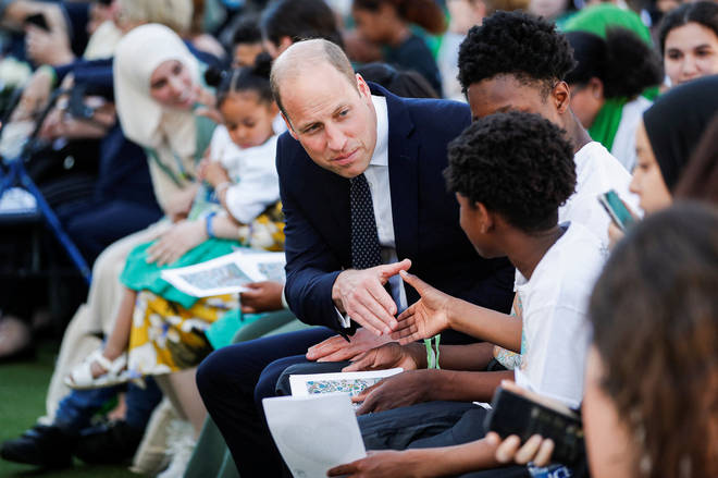 Prince William, Duke of Cambridge speaks with attendees during a memorial service to mark the fifth anniversary of the Grenfell Tower fire.