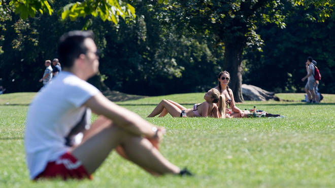 People sunbathing in London park