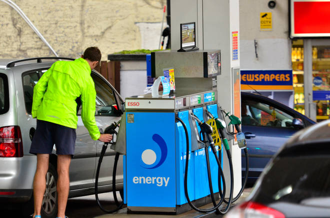 Man filling up car on petrol forecourt