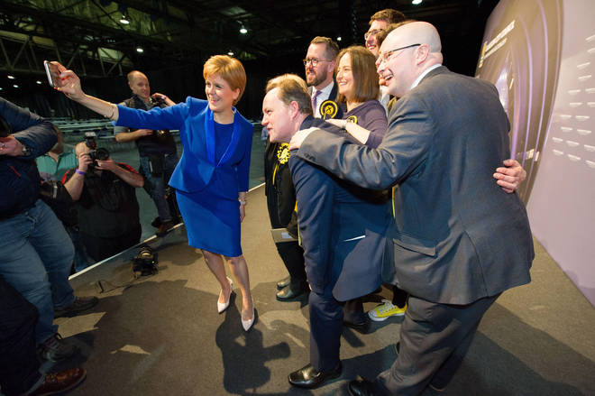 Nicola Sturgeon posing for a selfie with SNP MPs including Patrick Grady on the far right.