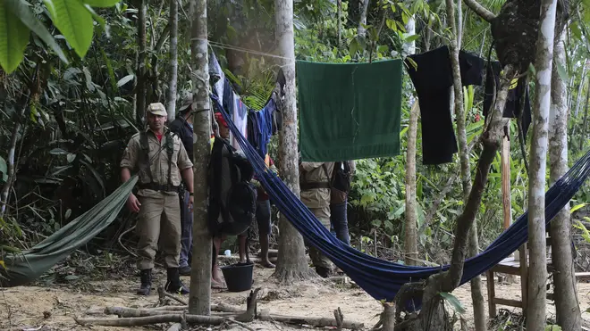 Firefighters arrive at a camp set up by Indigenous people to search for Indigenous expert Bruno Pereira and freelance British journalist Dom Phillips in Atalaia do Norte, Amazonas state, Brazil