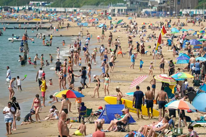 Thousands of people flocked to Britain's coastlines to make the most of the hot weather