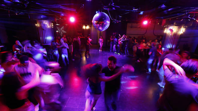 Couples dance at a club in Damascus, Syria