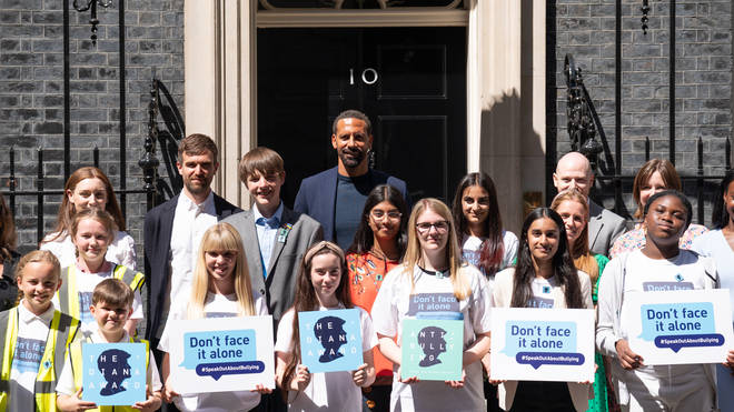 Rio Ferdinand poses for photographs with children at 10 Downing Street to celebrate the launch of the Diana Award’s annual anti-bullying campaign Don’t Face It Alone (Stefan Rousseau/PA)