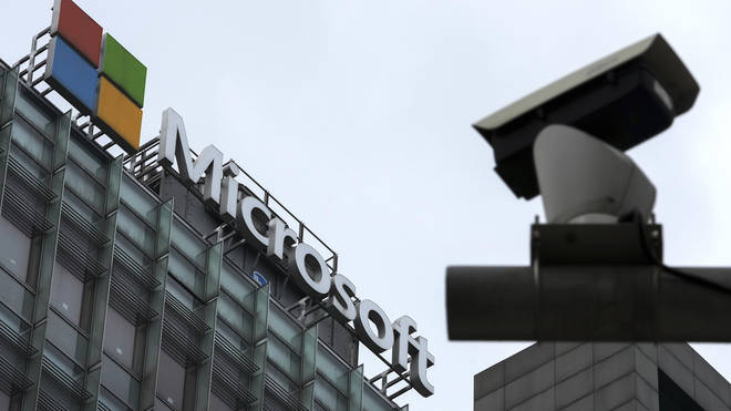 A security surveillance camera is seen near the Microsoft office building in Beijing