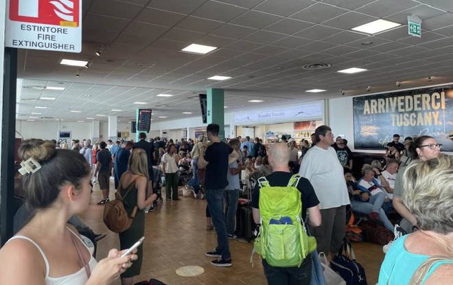 Passengers were delayed before being left 'stranded' in the corridor at the airport