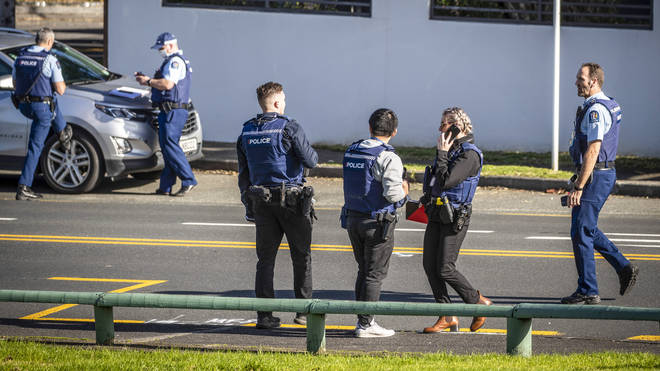 Police set up cordons and search area around a suburb of Auckland following reports of multiple stabbings in New Zealand