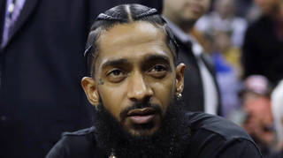 Rapper Nipsey Hussle attends an NBA basketball game in 2018