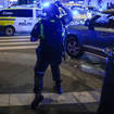 Police gather at the site of a shooting in Oslo (Javad Parsa/NTB via AP)