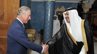 Prince Charles shakes hands with the then Qatari Prime Minister Sheikh Hamad Bin Jassim al Thani, at his residence outside Doha, Qatar in 2013.