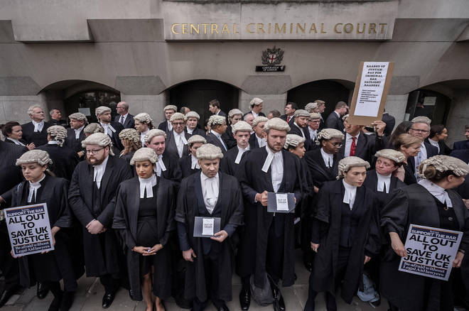 Barristers have walked out in a strike over pay and conditions
