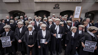Barristers have walked out in a strike over pay and conditions
