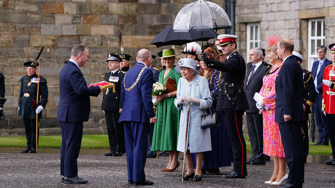 Queen Elizabeth II is greeted as she attends the Ceremony of the Keys on the forecourt of the Palace of Holyroodhouse in Edinburgh, accompanied by the Earl and Countess of Wessex, as part of her traditional trip to Scotland for Holyrood week.