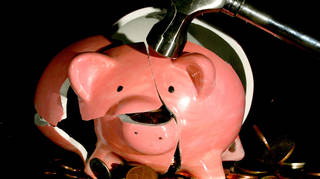 A piggy bank being smashed