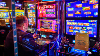 Laminated signs on gambling machines notify the gamers if a table is disinfected and ready to play or requires a clean before a new user can play