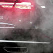 A car surrounded by exhaust fumes
