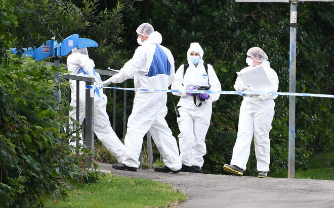 Forensic investigators at the scene after Logan's body was found