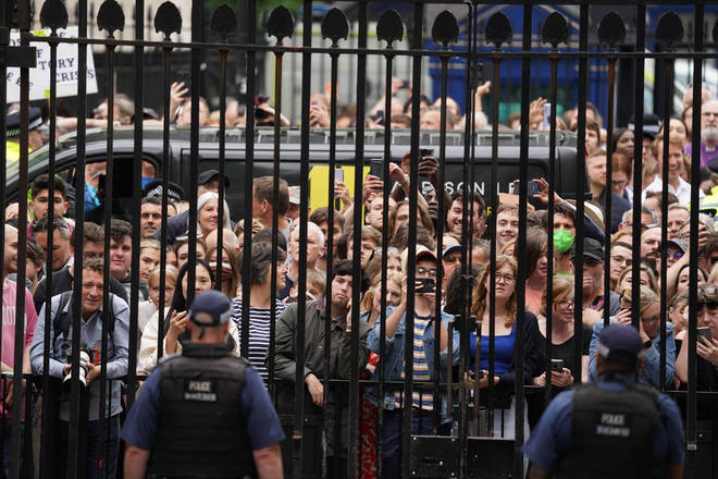 A crowd of members of the public gathered at the gates of Downing Street