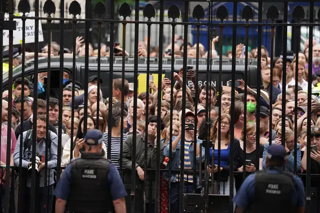 A large crowd gathered at the gates of Downing Street to watch the PM's speech