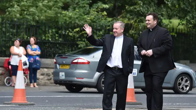 Father Dermott Donnelly (left) in 2015