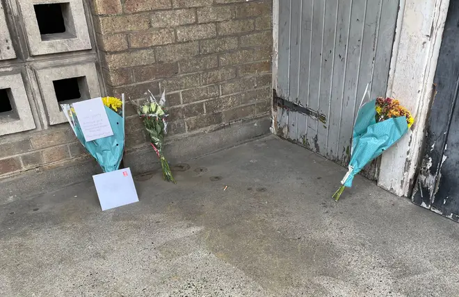 Flowers left at the scene of James Markham's murder