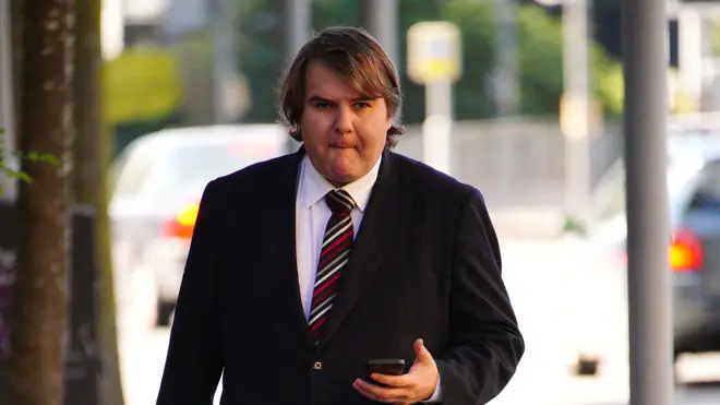 Wallis (pictured arriving at court today) claims he crashed after swerving to avoid hitting a cat and left the scene out of fear he would be "raped, killed or kidnapped" due to post-traumatic stress disorder which he developed after being raped in September. 