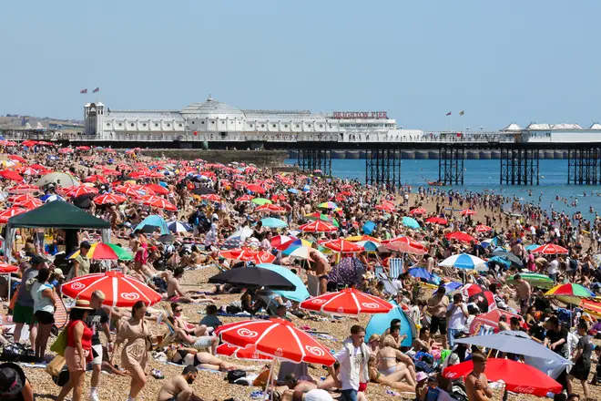 Thousands of people flocked to Britain's beaches on Friday