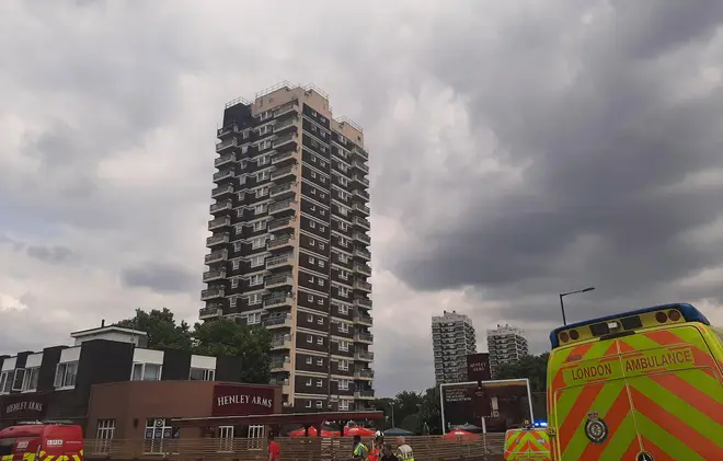 Firefighters have put out a flat fire after it broke out at the top of a block of flats in North Woolwich. 
