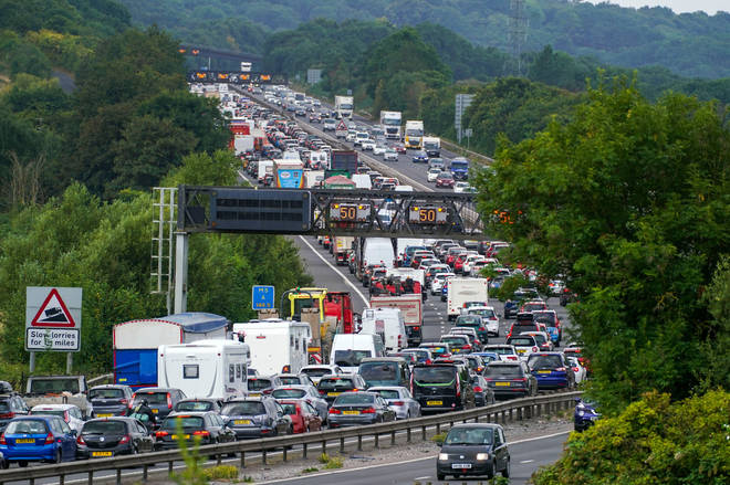 Vehicles queue on the M5 near Portbury, Bristol, as families embark on getaways at the start of summer holidays.