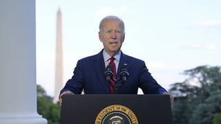 President Joe Biden speaks from the Blue Room Balcony of the White House