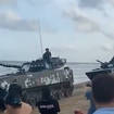 Beijing 'masses tanks on beaches' opposite Taiwan