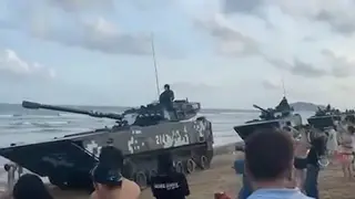 Beijing 'masses tanks on beaches' opposite Taiwan