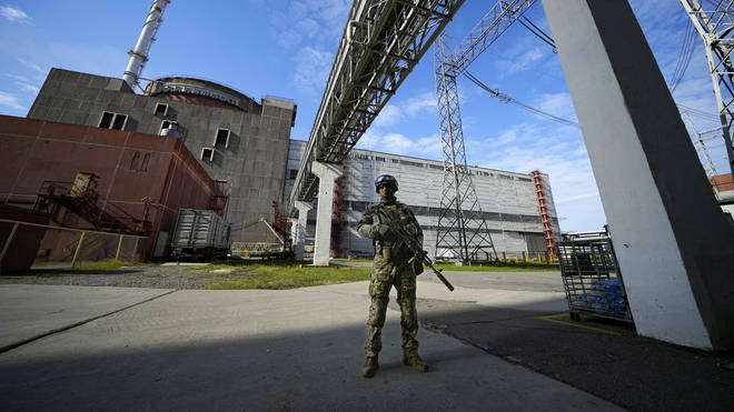 A Russian serviceman guards an area of the Zaporizhzhia Nuclear Power Station in territory under Russian military control in south-eastern Ukraine