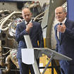 German Chancellor Olaf Scholz, right, stands beside Christian Bruch, chief executive of Siemens Energy, at the turbine serviced in Canada for the Nordstream 1 natural gas pipeline in Muelheim an der Ruhr, Germany