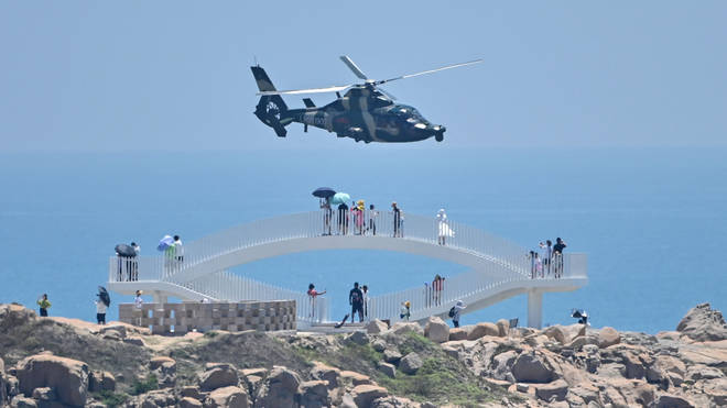 A Chinese helicopter flies past Pingtan island, one of mainland China's closest point from Taiwan