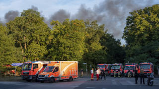 Fire engines and ambulances stand on Kronprinzessinnen Road at the Grunewald forest in Berlin, Germany