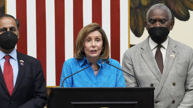 US House Speaker Nancy Pelosi, centre, with a congressional delegation Raja Krishnamoorthi, left, and House Foreign Affairs Committee Chairman Rep. Gregory Meeks, speaks during a news conference at the U.S. Embassy in Tokyo on Friday, August 5, 2022