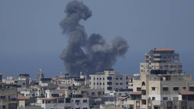 Smoke rises following Israeli air strikes on a building in Gaza City