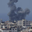 Smoke rises following Israeli air strikes on a building in Gaza City