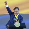 President Gustavo Petro raises his fist at the end of his inauguration speech in Bogota, Colombia, Sunday, August 7, 2022